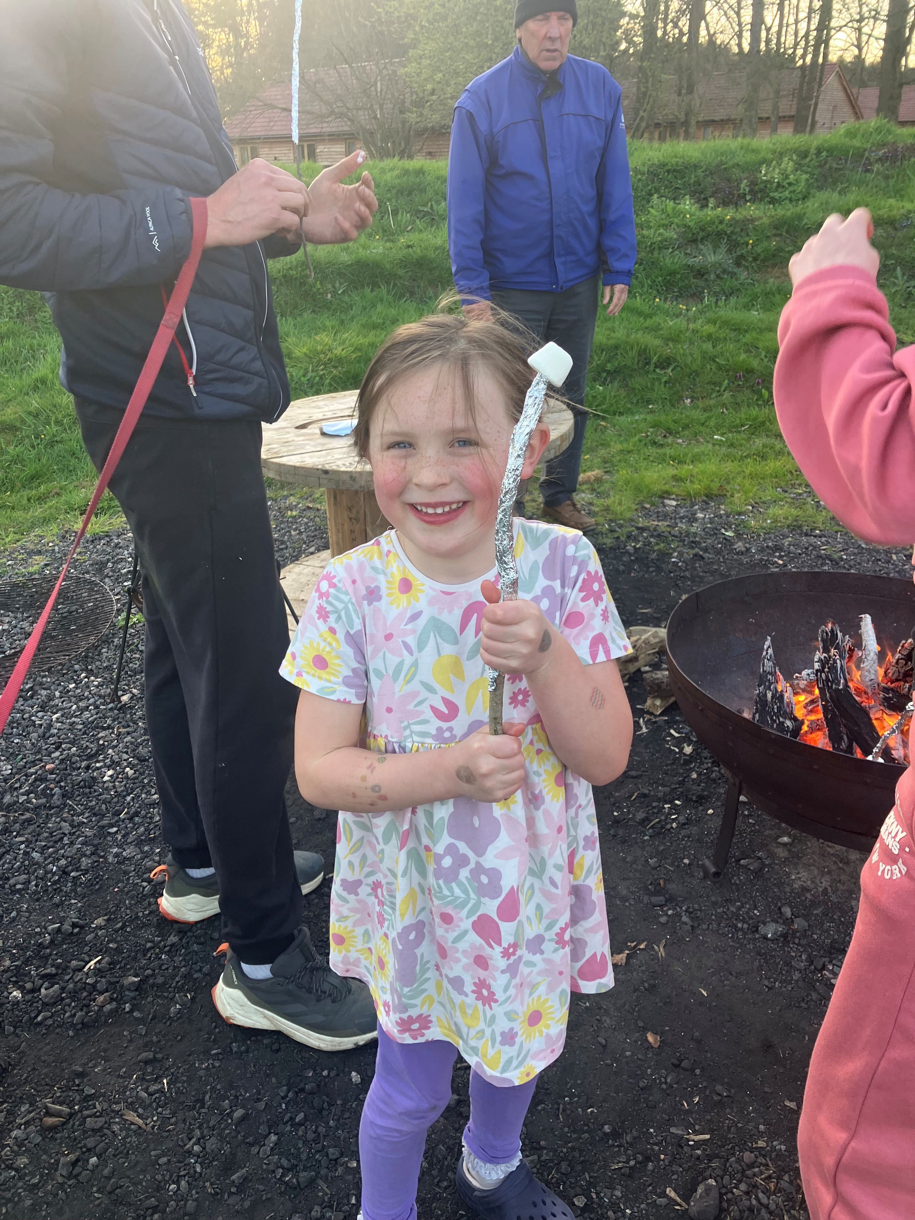 Roasting marshmallows at the fire pit